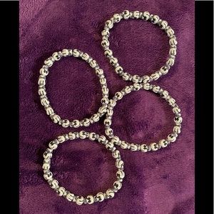 Set of 4 never worn black & white skull bracelets